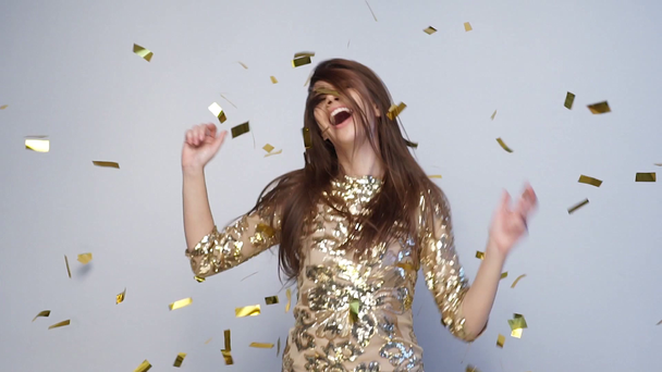 Party Celebration. Happy Woman Throwing Gold Confetti, Dancing - Video, Çekim