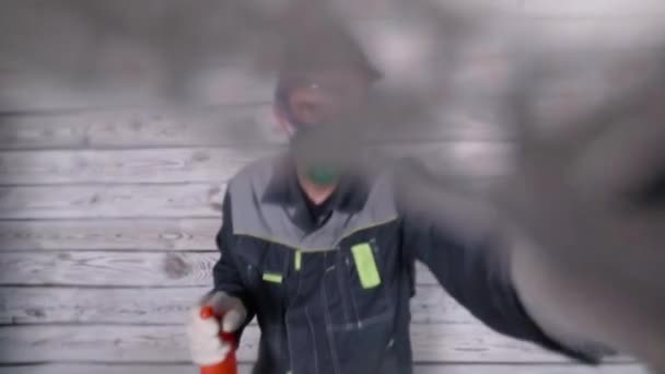 soft focus Cleaner in masks and respirator spray to camera and washes it - Footage, Video