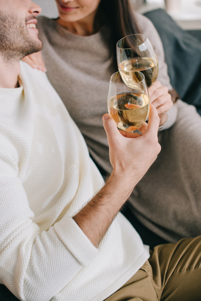 cropped shot of young couple drinking wine at home - Foto, Imagen