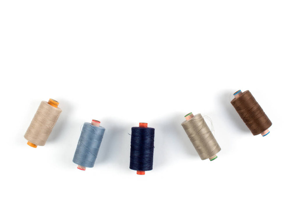 Color sewing threads on white background, top view - Photo, Image