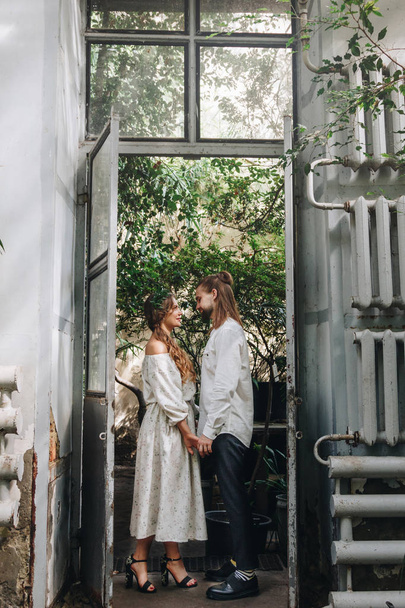 Beautiful wedding couple in botanical garden - Photo, image