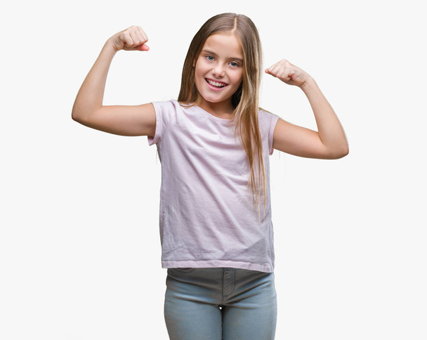 Young beautiful girl over isolated background showing arms muscles smiling proud. Fitness concept. - Photo, image