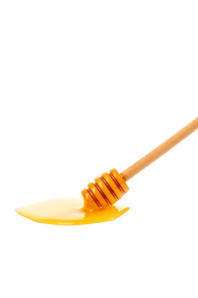 honey with wooden drizzler isolated on white background - Φωτογραφία, εικόνα