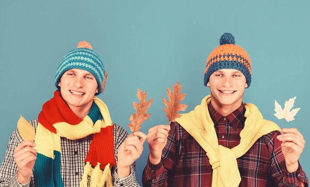 Autumn season and weather concept. Guys in knit scarves - Photo, image