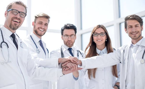 group of doctors with their hands folded together - Foto, imagen