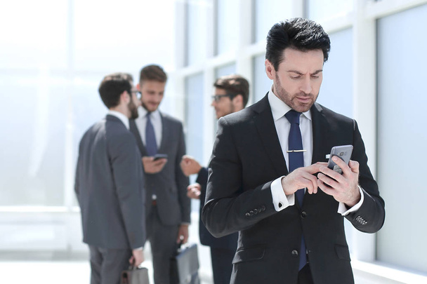businessman typing SMS on smartphone - Photo, Image