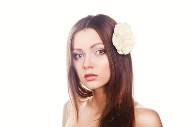 Skincare of young beautiful woman face with fresh flower over white background - Φωτογραφία, εικόνα