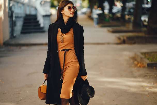 stylish girl walking through the city - Photo, image