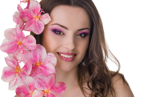 schöne Frau mit Orchidee im Ohr - Foto, Bild