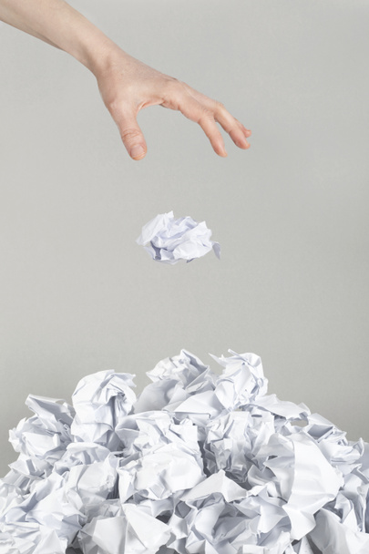 Stack of crumpled paper balls and hand - Fotoğraf, Görsel