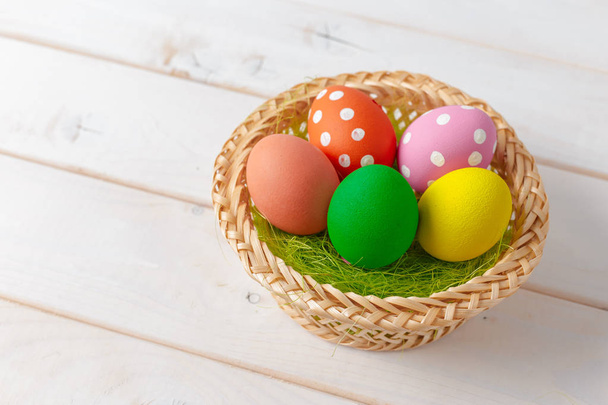 easter holiday background of colorful eggs in the basket - Photo, Image