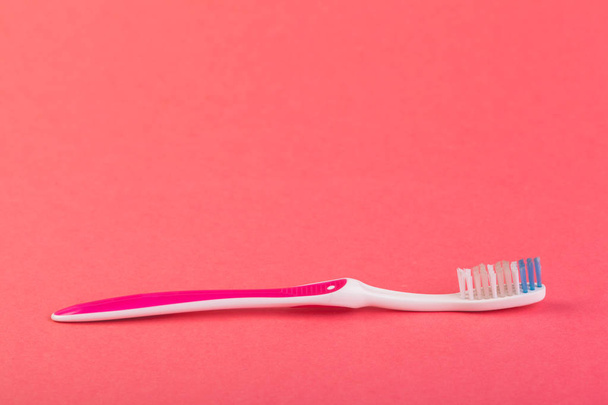close up of Toothbrush on red background - Φωτογραφία, εικόνα