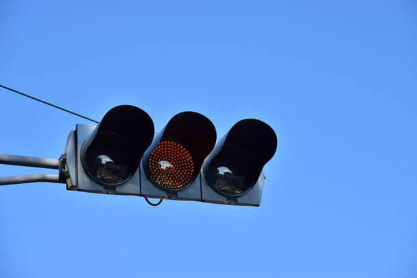 Japanese yellow traffic light of the day of the blue sky which it was fine - 写真・画像