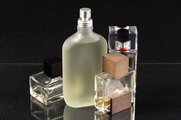 close up of perfume bottles on a dark background - Valokuva, kuva