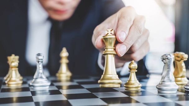 Businessman playing chess game reaching to plan strategy for success, thinking for planning overcoming difficulty and achieving goals business strategy for win, management or leadership concept. - Photo, Image