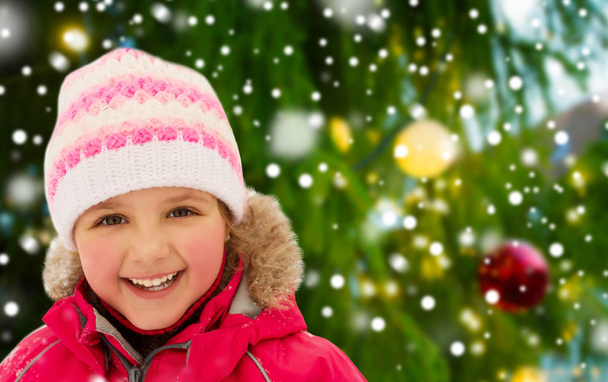 happy little girl in winter clothes outdoors - Fotoğraf, Görsel