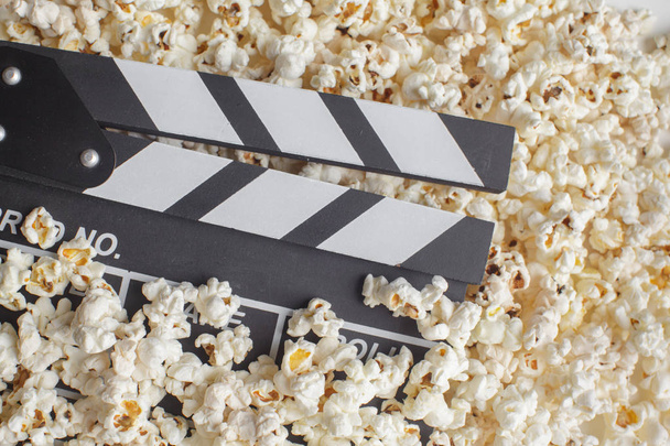 close up of Movie Clapper Board in popcorn - Фото, изображение