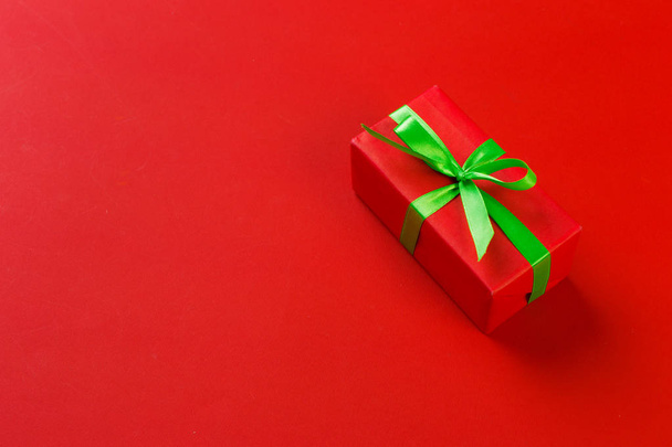 close up of gift box on colorful background - Foto, Imagen