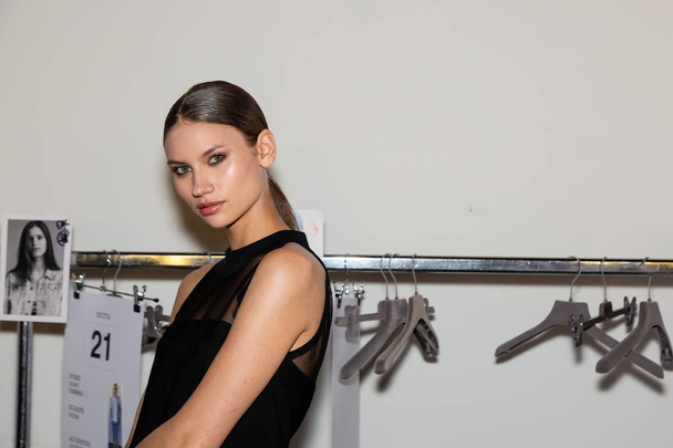 MILAN, ITALY - SEPTEMBER 23: Beautiful model poses in the backstage just before D.Exterior show during Milan Women's Fashion Week on SEPTEMBER 23, 2018 in Milan. - Fotó, kép