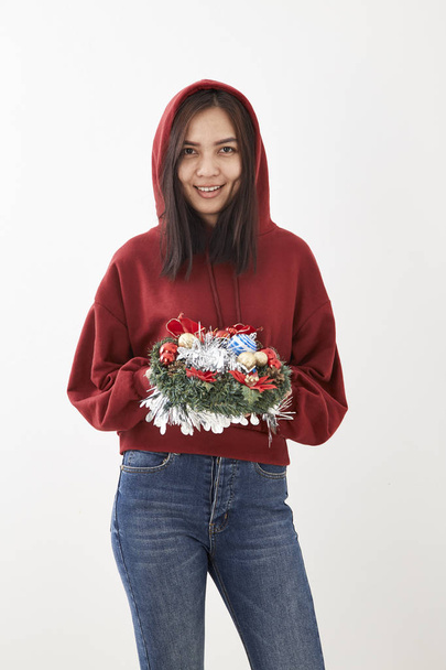 A young girl with a wreath of Christmas wreath - Photo, image