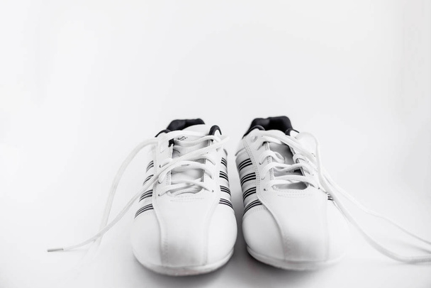 White trainers with sripes, Women wear mens wear, sporty and healthy life - Photo, Image