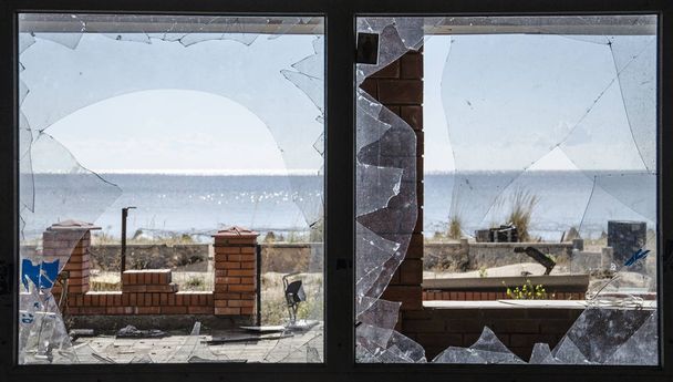 The war in Ukraine. Settlement Shyrokyne, Donetsk region. September 2018. Buildings destroyed as a result of military actions of the Russian invaders in 2014-2018. - Photo, Image