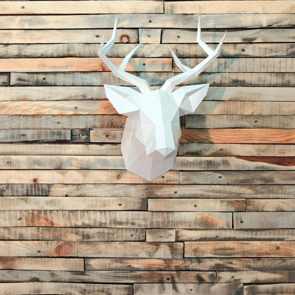 Paper deer head on the wall of wooden bars. Designer background for decoration in the room. Square picture. New Year's wall decoration. - Photo, Image