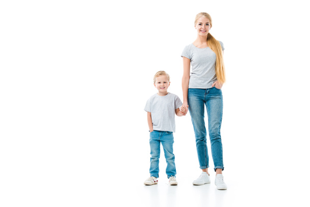 Mom and son holding hands and looking at camera isolated on white - Foto, Imagen