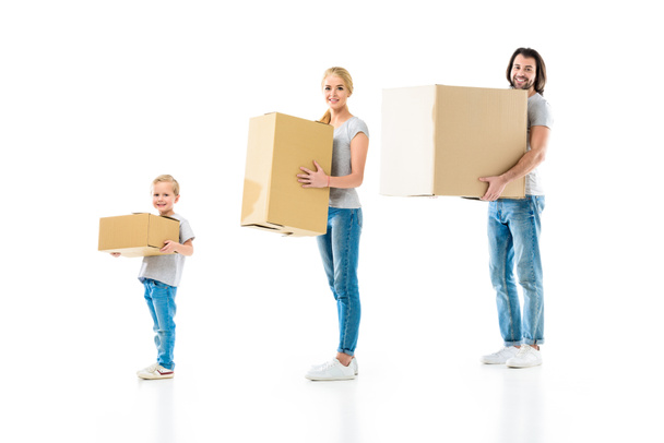 happy family holding boxes of different size isolated on white - Photo, Image