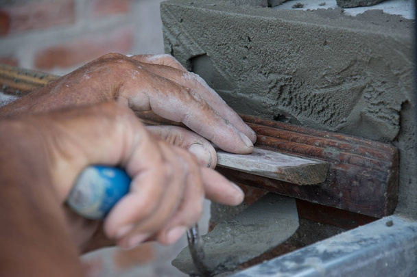 plasterer concrete worker at wall of house construction  - Foto, Imagem