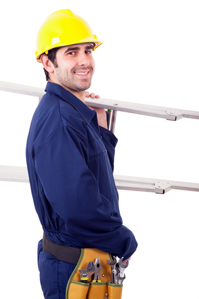 Portrait of a happy worker holding a ladder, isolated on white - Foto, Imagem