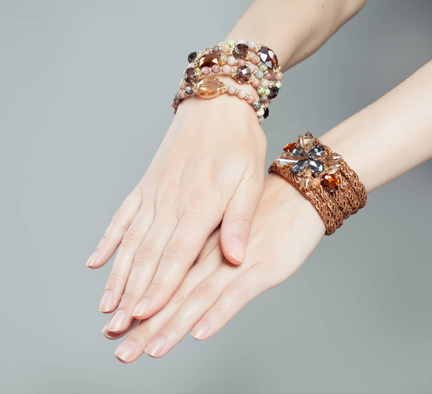 Beautiful woman hands with jewelry bracelet closeup - Valokuva, kuva
