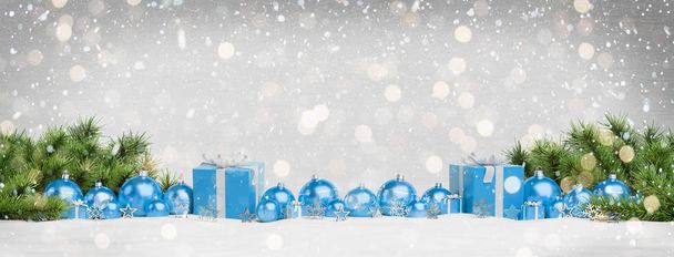 Blue christmas gifts and baubles lined up on grey snowy background 3D rendering - Photo, Image