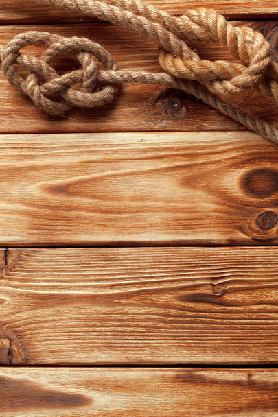 ship rope at wooden background - 写真・画像