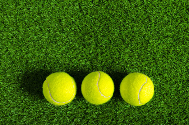 Tennis ball on green grass - Φωτογραφία, εικόνα