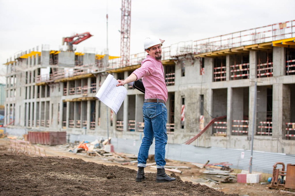 Architect at a construction site celebrate after construction project was successful. - Фото, зображення