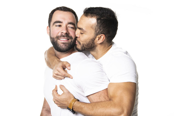 Young homosexuals gay couple love each other on a white background. - Foto, afbeelding