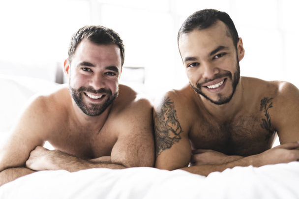 A Handsome gay men couple on bed together - Zdjęcie, obraz
