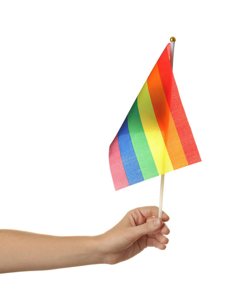 Γυναίκα που κρατά την σημαία του ΛΟΑΤ ουράνιο τόξο σε λευκό φόντο - Φωτογραφία, εικόνα