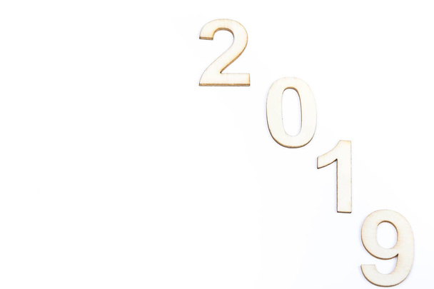 Close up 2019 year celebrate with wooden numbers on white background. Clean, cleaned, purity design. Copy space - Φωτογραφία, εικόνα