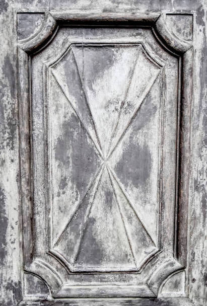 A geometric detail of an ancient wooden door. Suitable to be used like a background. - Zdjęcie, obraz