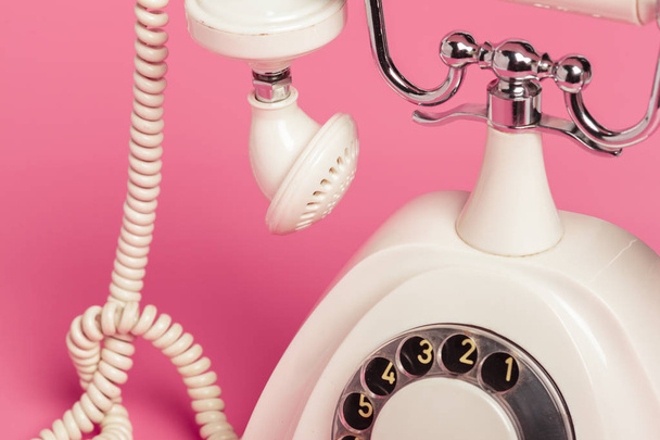 Retro white telephone on pink background - Foto, Bild