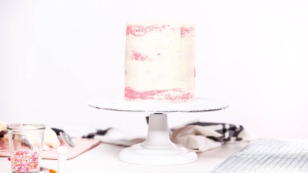 Step by step. Icing tall birthday cake with white buttercream icing. - Photo, Image