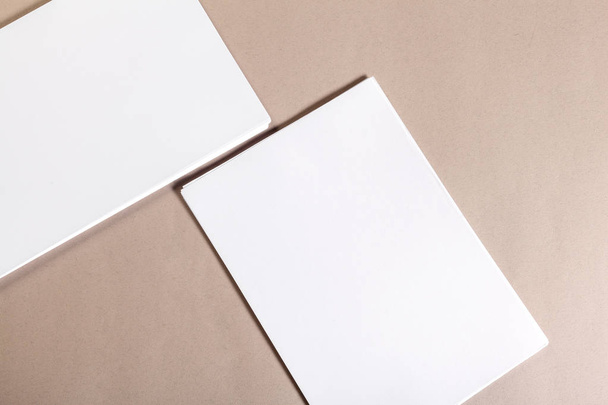 Blank paper pieces for mock up on a beige background - Foto, afbeelding