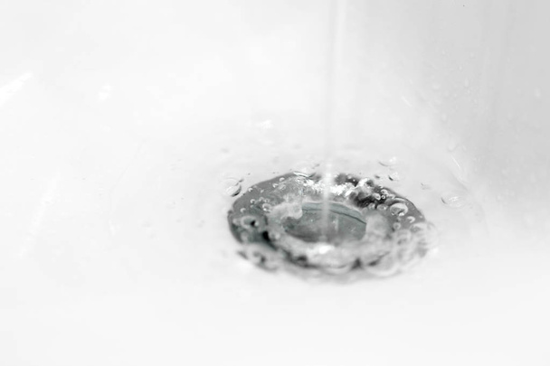 Water in sink  on background,close up - 写真・画像