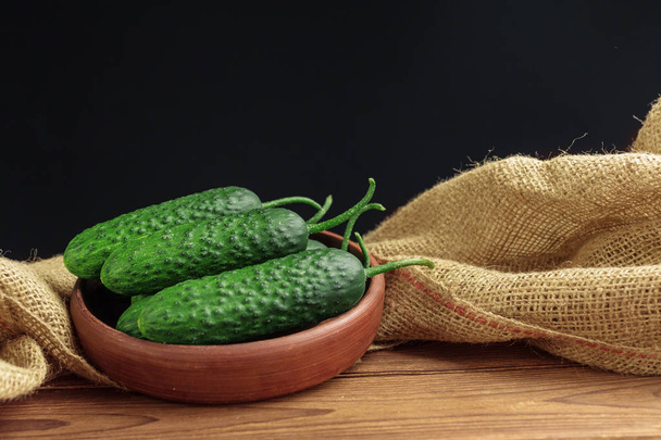Cucumber on wooden background - Photo, image