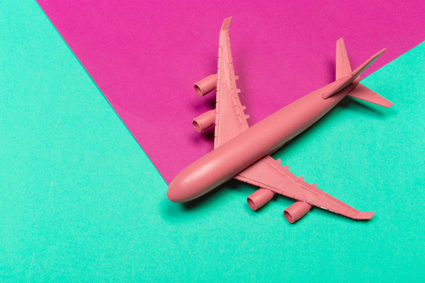 Flat lay of miniature toy airplane - Фото, изображение