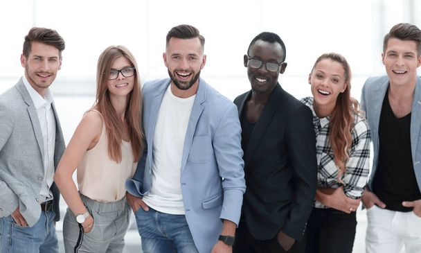 Happy group of people standing in a row over white background - Foto, Imagem