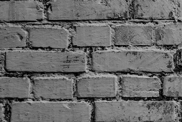 Brick texture with scratches and cracks. It can be used as a background - Foto, Imagen