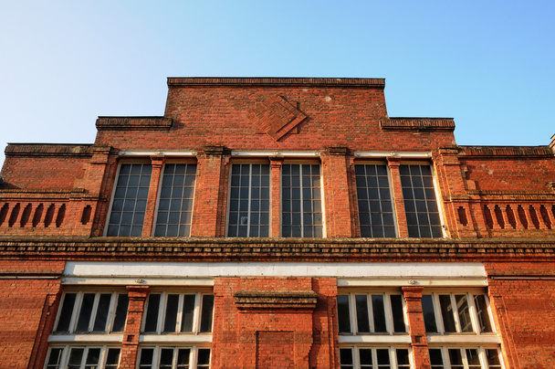 facade of an old factory in Bonnieres - Foto, Bild